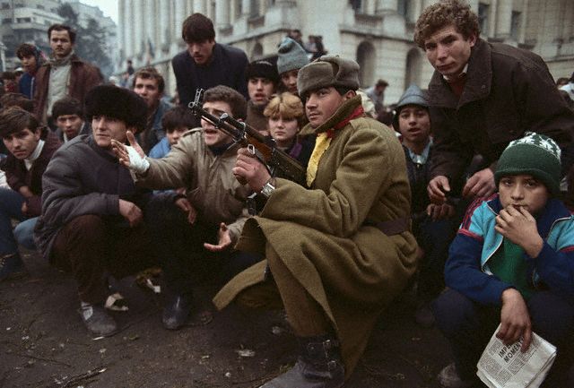 Students, soldiers and children participating in the Romanian Revolution. Image by © David Turnley/CORBIS